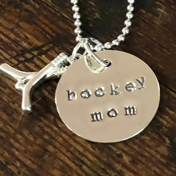 Hockey Sticks Charm added to a silver necklace