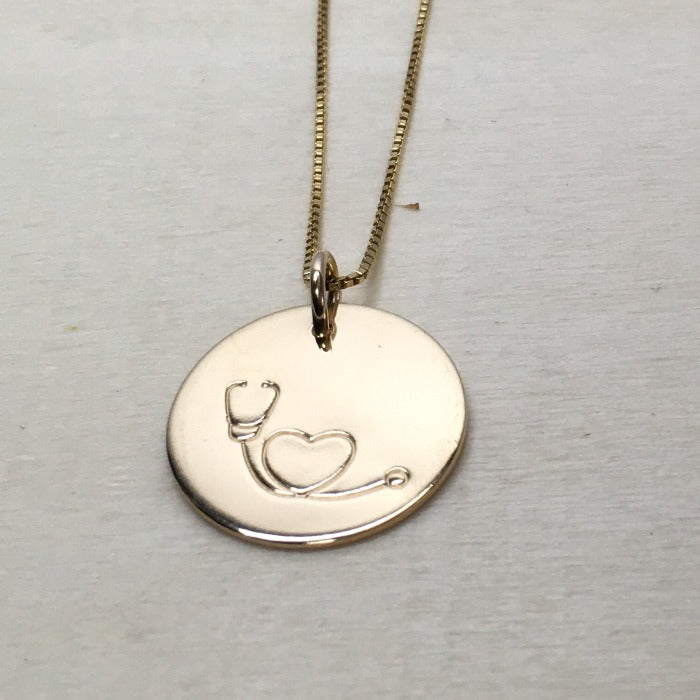 Stethoscope necklace in gold