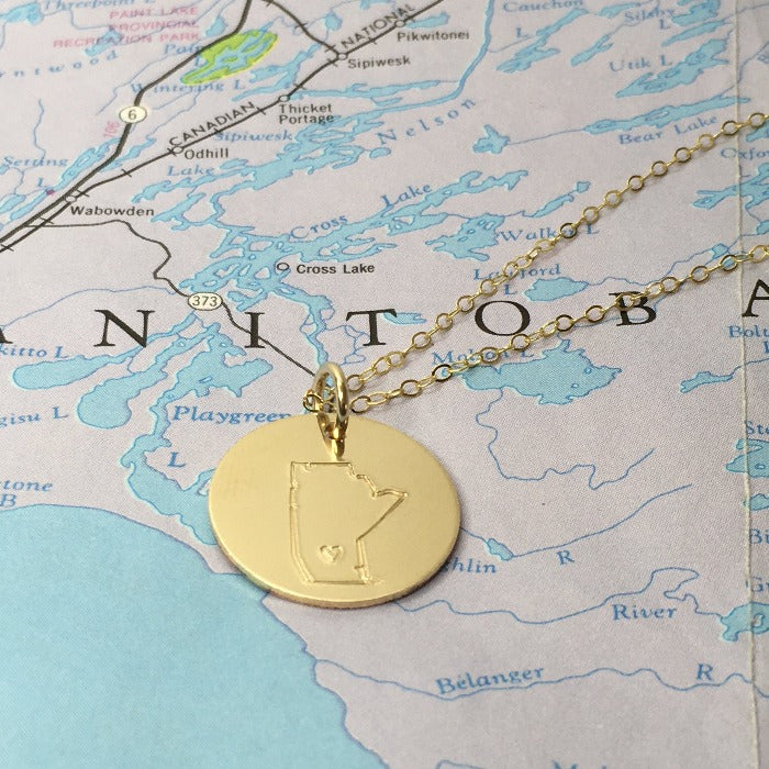 Gold hand stamped Manitoba necklace with hand stamped heart on the hometown