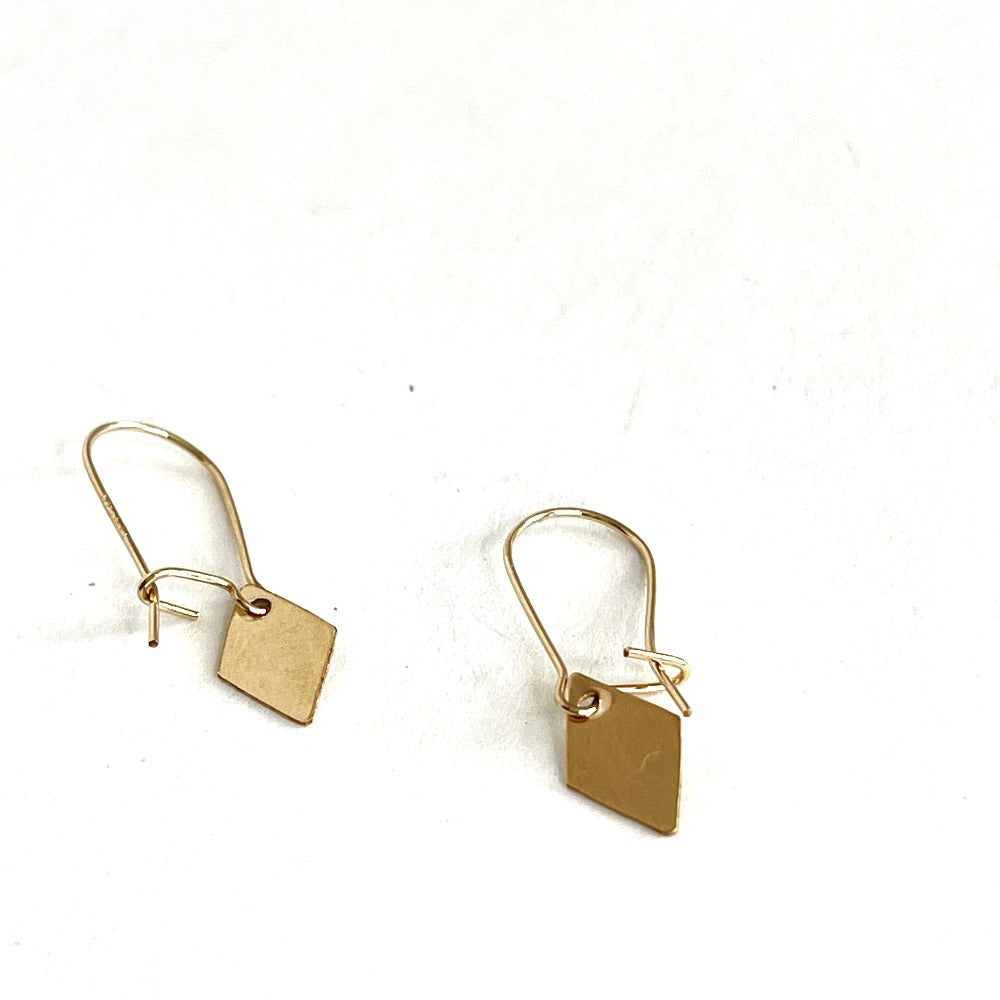 Gold filled diamond shaped earrings hang from simple kidney wires with closure