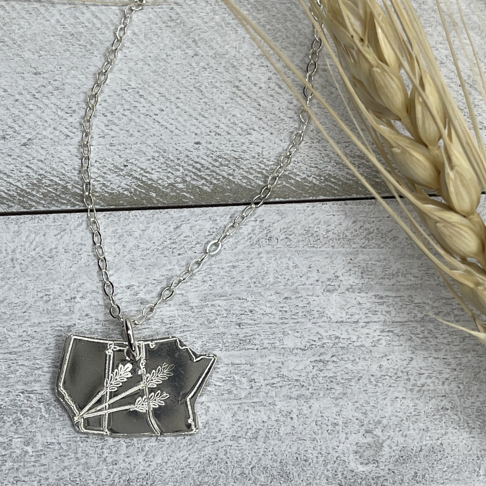 Prairie Proud necklace with 3 stalks of wheat stamped on it.  Province jewelry with wheat