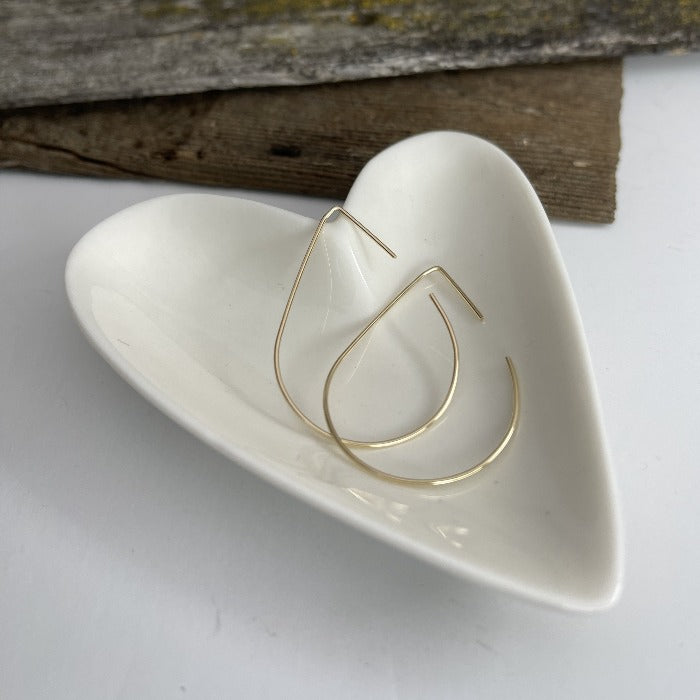 Teardrop shaped wire earrings in a heart shaped bowl.  Made of 14K gold fill or sterling silver.
