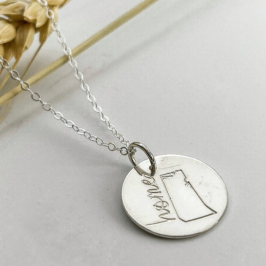 Saskatchewan hand stamped on a sterling necklace disk