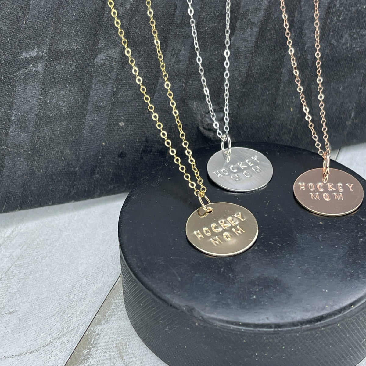 Hand stamped Hockey Mom Necklaces handmade by Marni LuHu in 14K Gold and Rose Gold Fill and sterling Silver