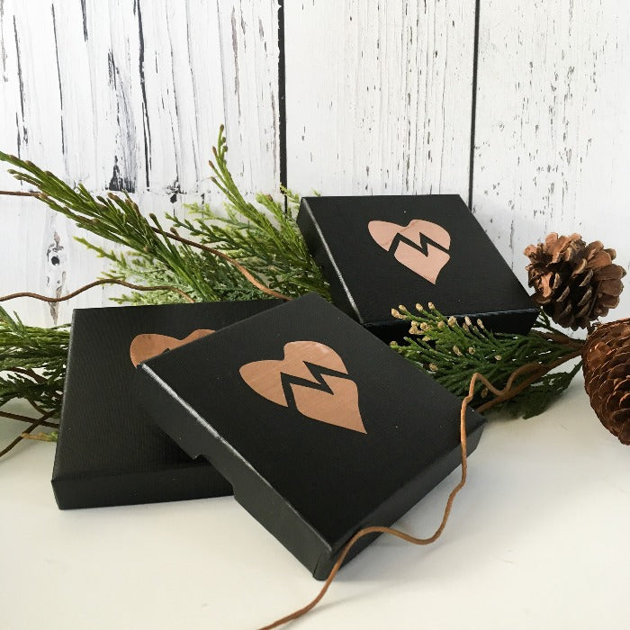 Marni LuHu black gift boxes with a copper foil heart on it it logo