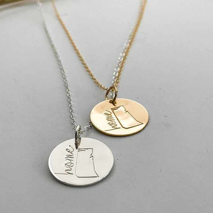 Sterling silver and gold hand-stamped Saskatchewan necklaces with HOME